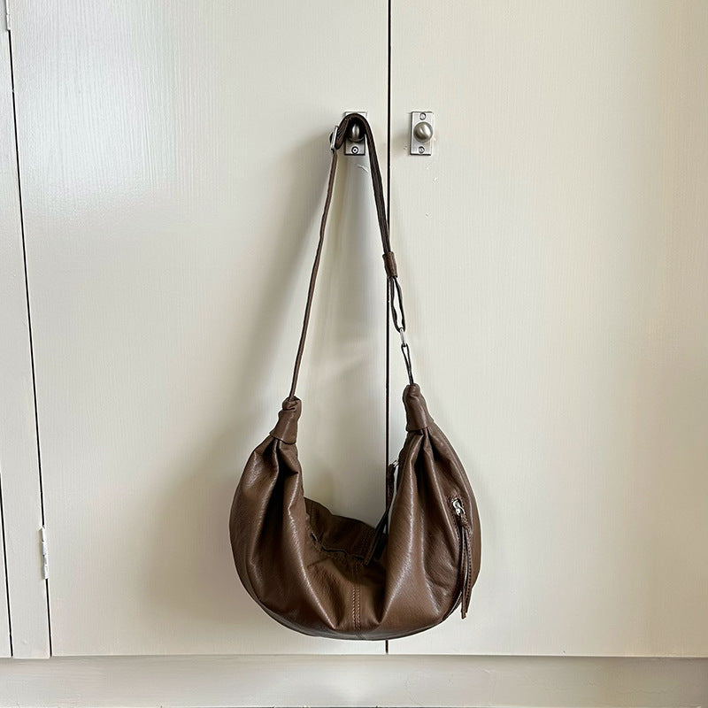 Women's shoulder purse with space for a tablet and wallet.