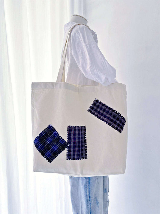 Sustainable canvas tote bags with unique hand-stitched designs. An ideal choice for minimalists who value craftsmanship and environmental responsibility.