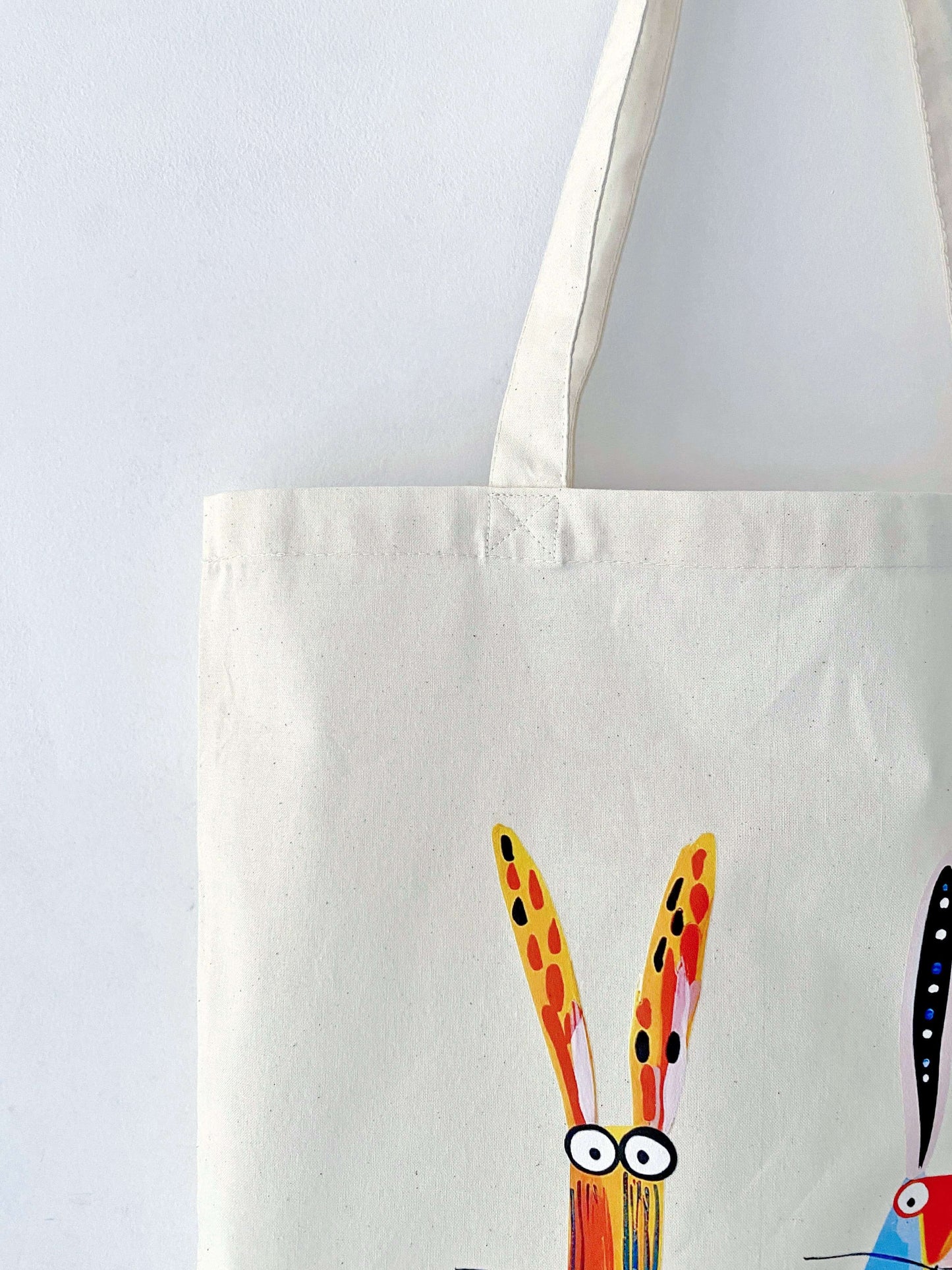 Cottagecore aesthetic outfit paired with a minimalist hand-printed bunny tote, capturing the slow living vibe often discussed in sustainable fashion communities.
