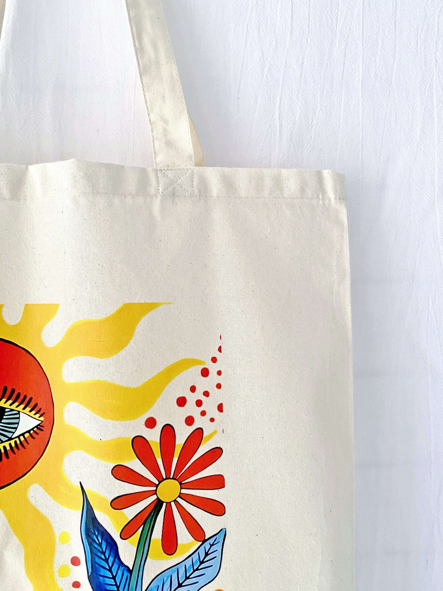 The soft fabric bag rolled up tightly in a suitcase, demonstrating a useful travel essential gift for the friend who is always on a plane.