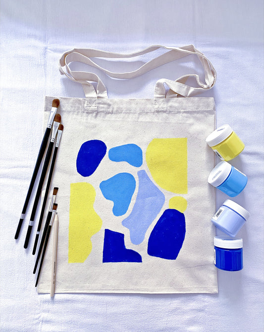 roomy everyday tote made from cotton canvas with a small artistic drawing