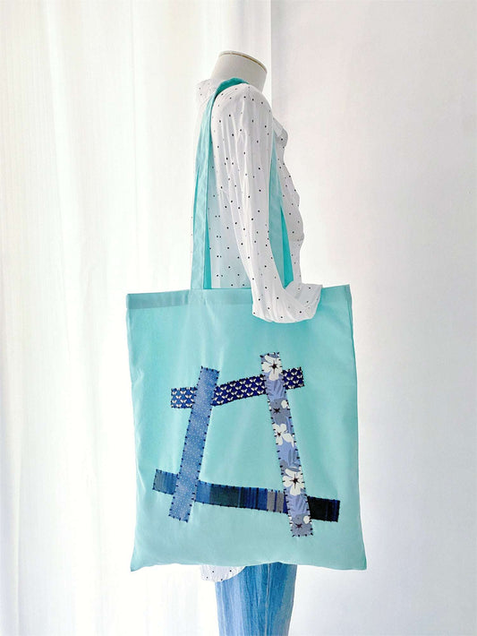 Large eco-friendly carryall made from natural materials, a favorite choice for zero-waste grocery runs and farmers markets.