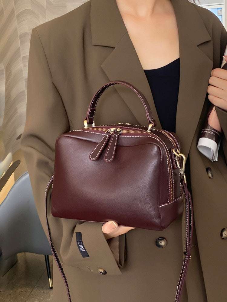 vintage-style satchel with double zippers