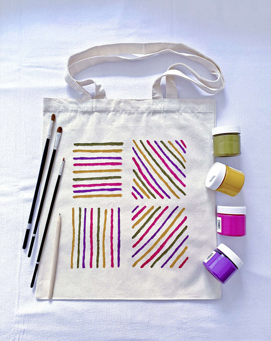 Natural sunlight hitting the hand-painted pattern on a large canvas tote.