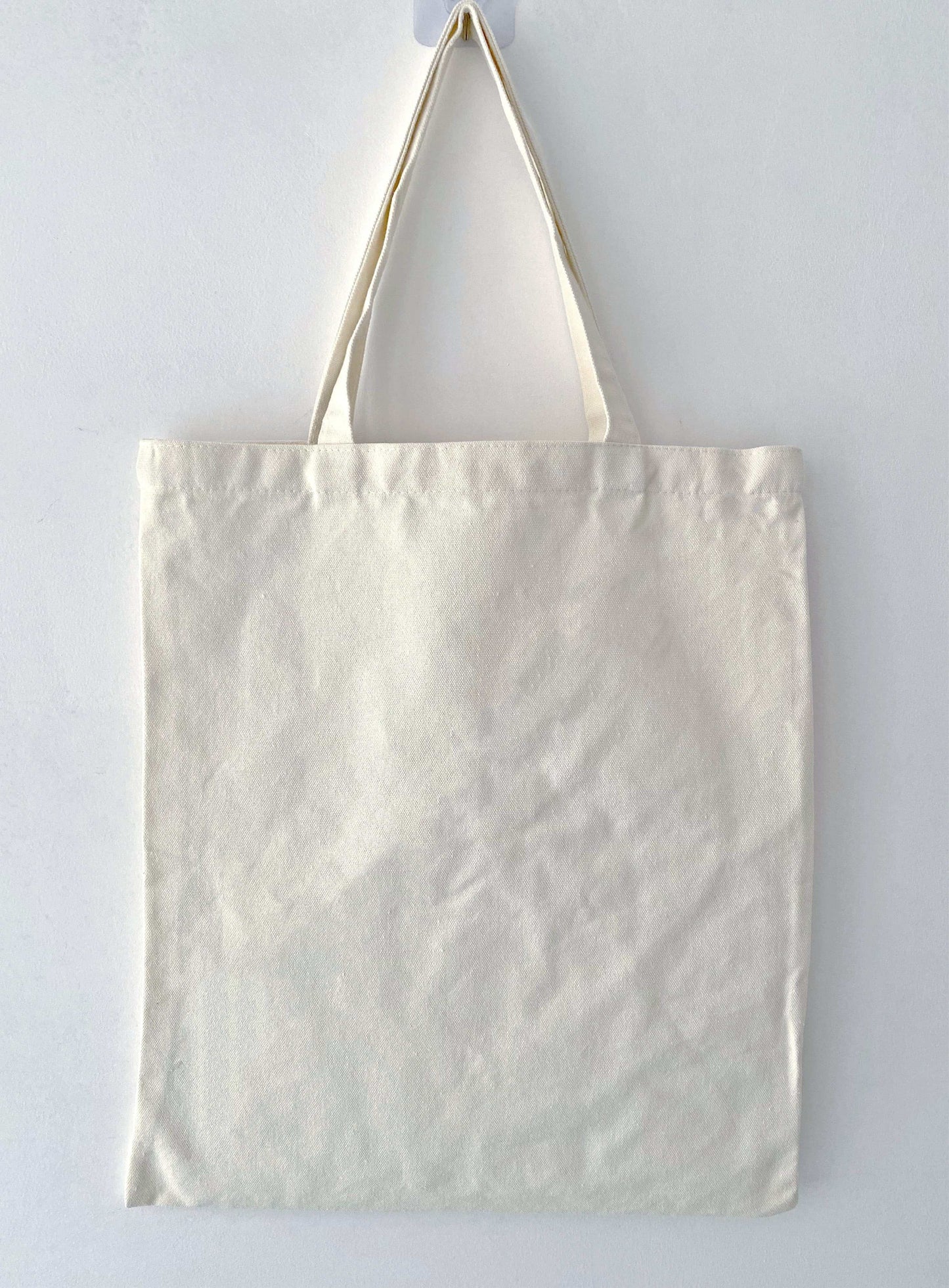 Perfect for the minimalist, this eco-friendly canvas tote bag keeps things simple, offering a large capacity for everything you need while supporting a sustainable lifestyle.