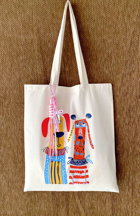 Large capacity tote filled with a laptop, a thick sweater, and a bottle.