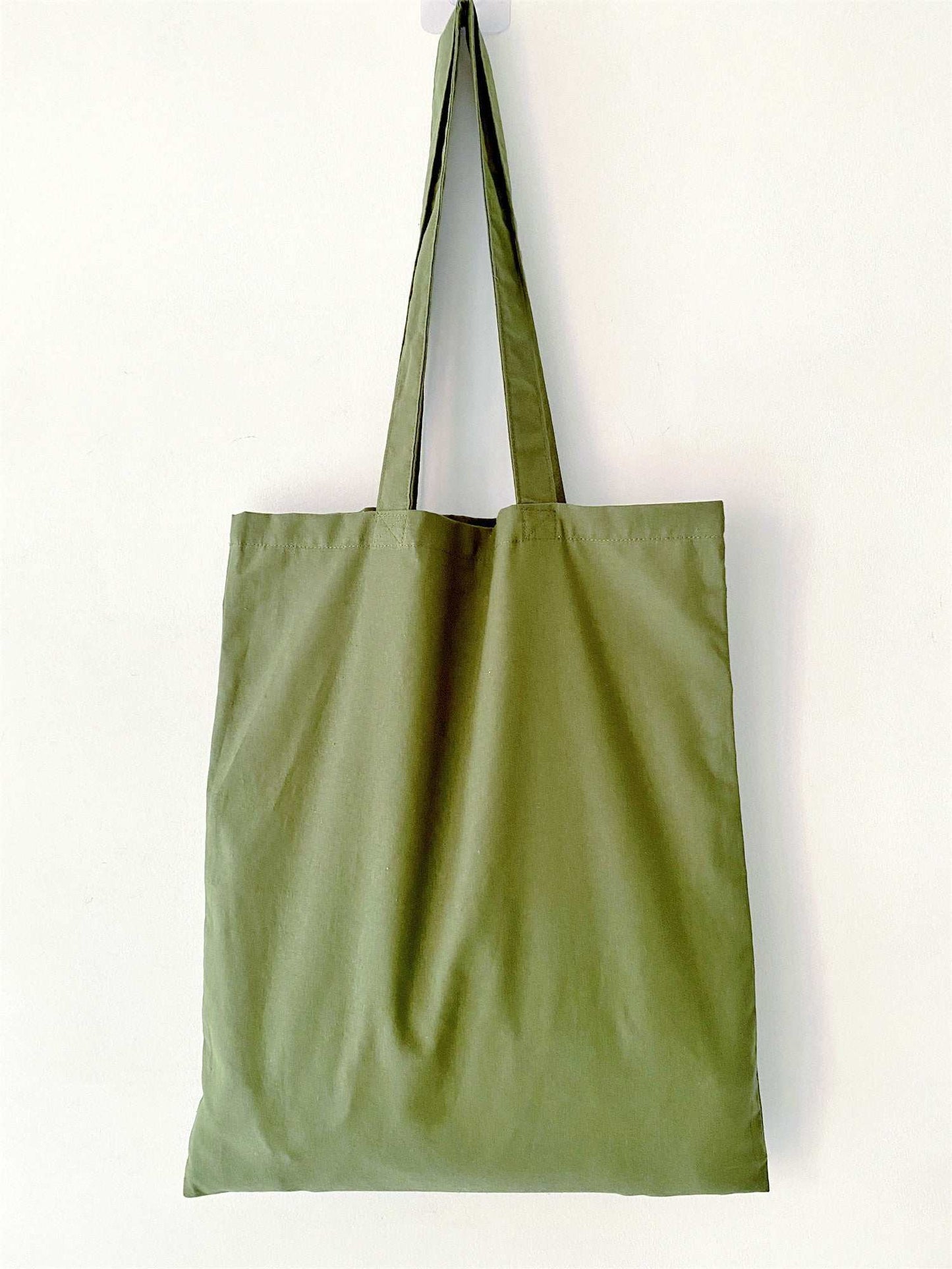 Surprise a bestie with this olive patchwork tote, a unique symbol of friendship and shared creative taste.