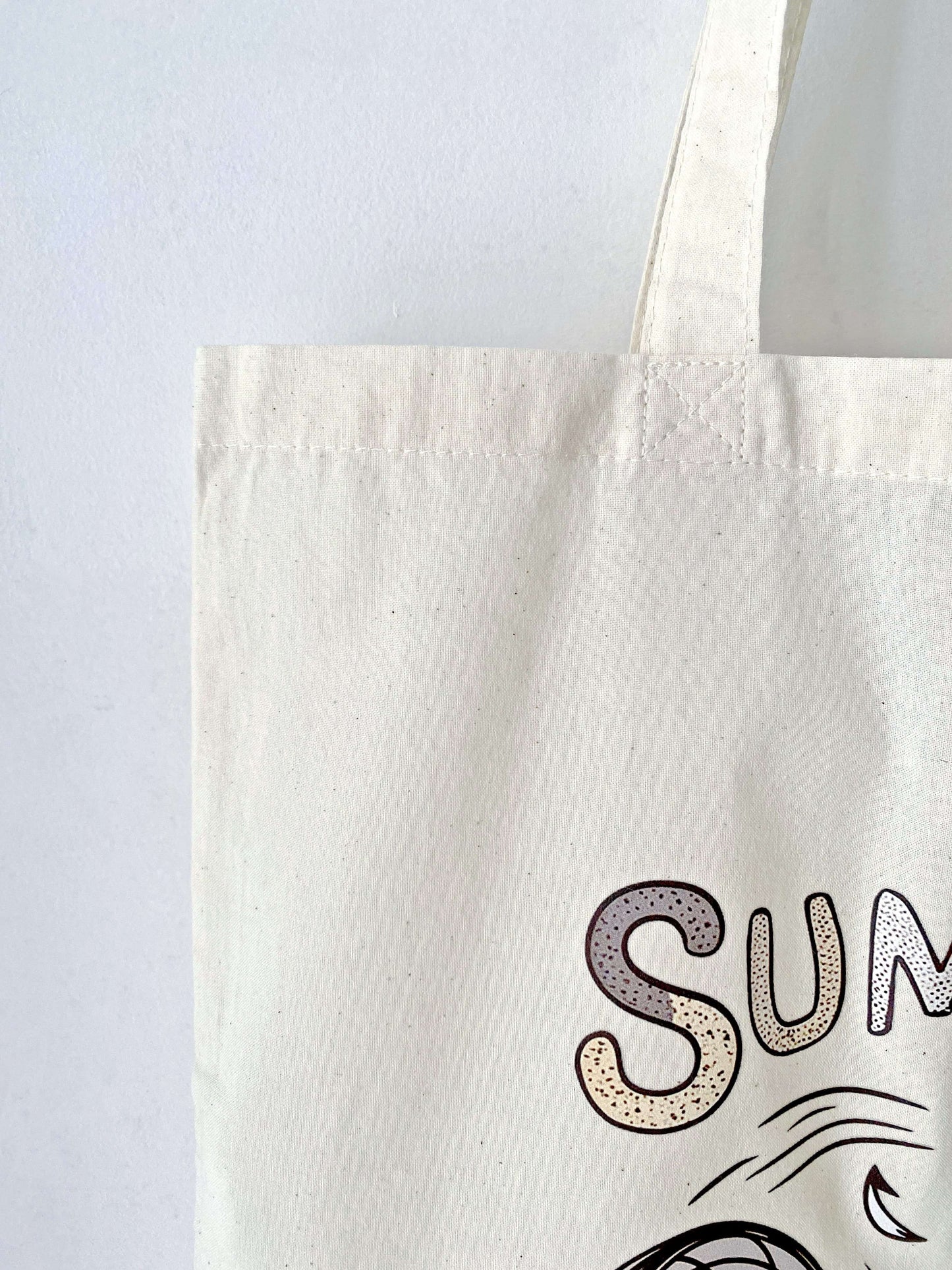 This lightweight, eco-friendly tote bag with a playful kitty print is perfect for running errands or carrying books in style.