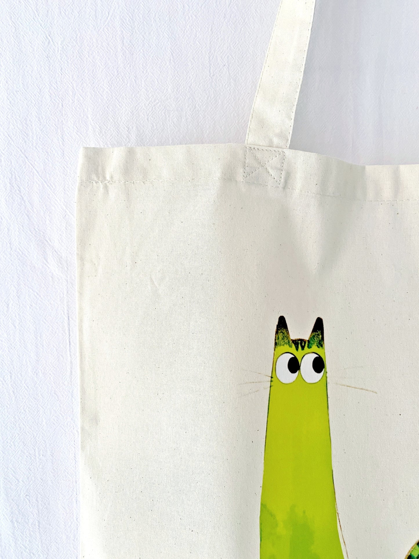 This hand-printed kitty tote fits naturally into everyday routines—workdays, coffee stops, or carrying a few books around.