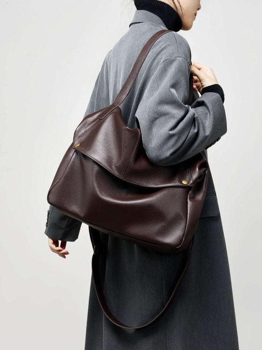 Woman wearing leather tote crossbody in city