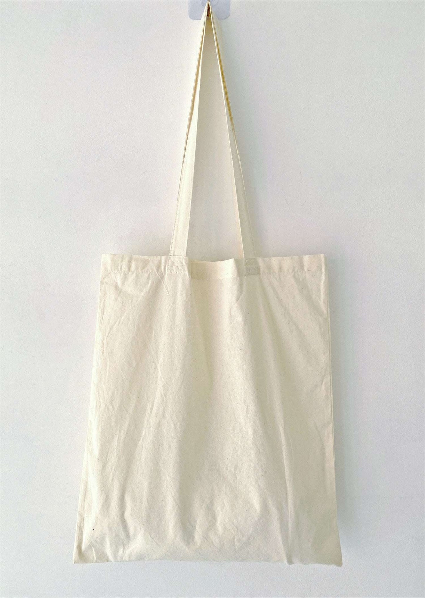Minimalist eco friendly outfit accessory featuring a subtle pop of color from traditional hand needlework