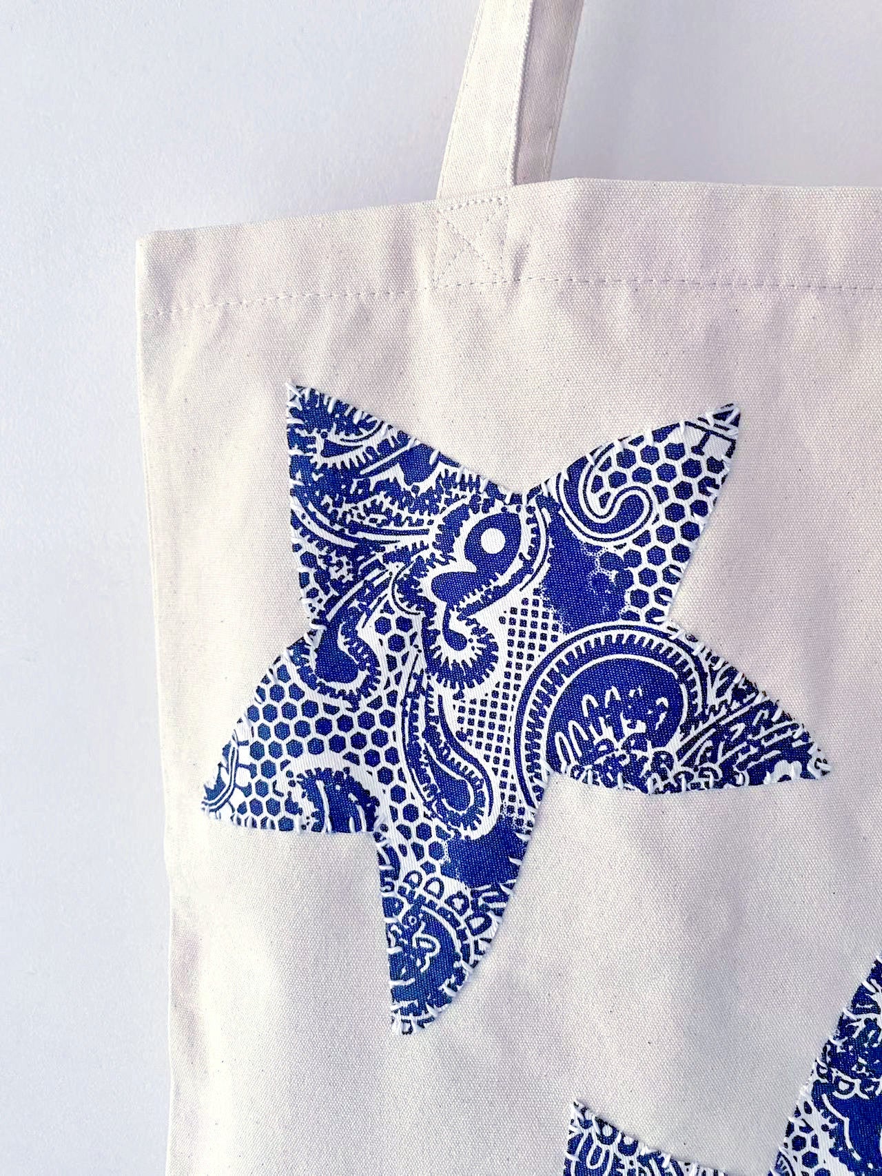 Eco-conscious gift idea: this handmade patchwork canvas tote, perfect for a friend who appreciates slow fashion and sustainable living.