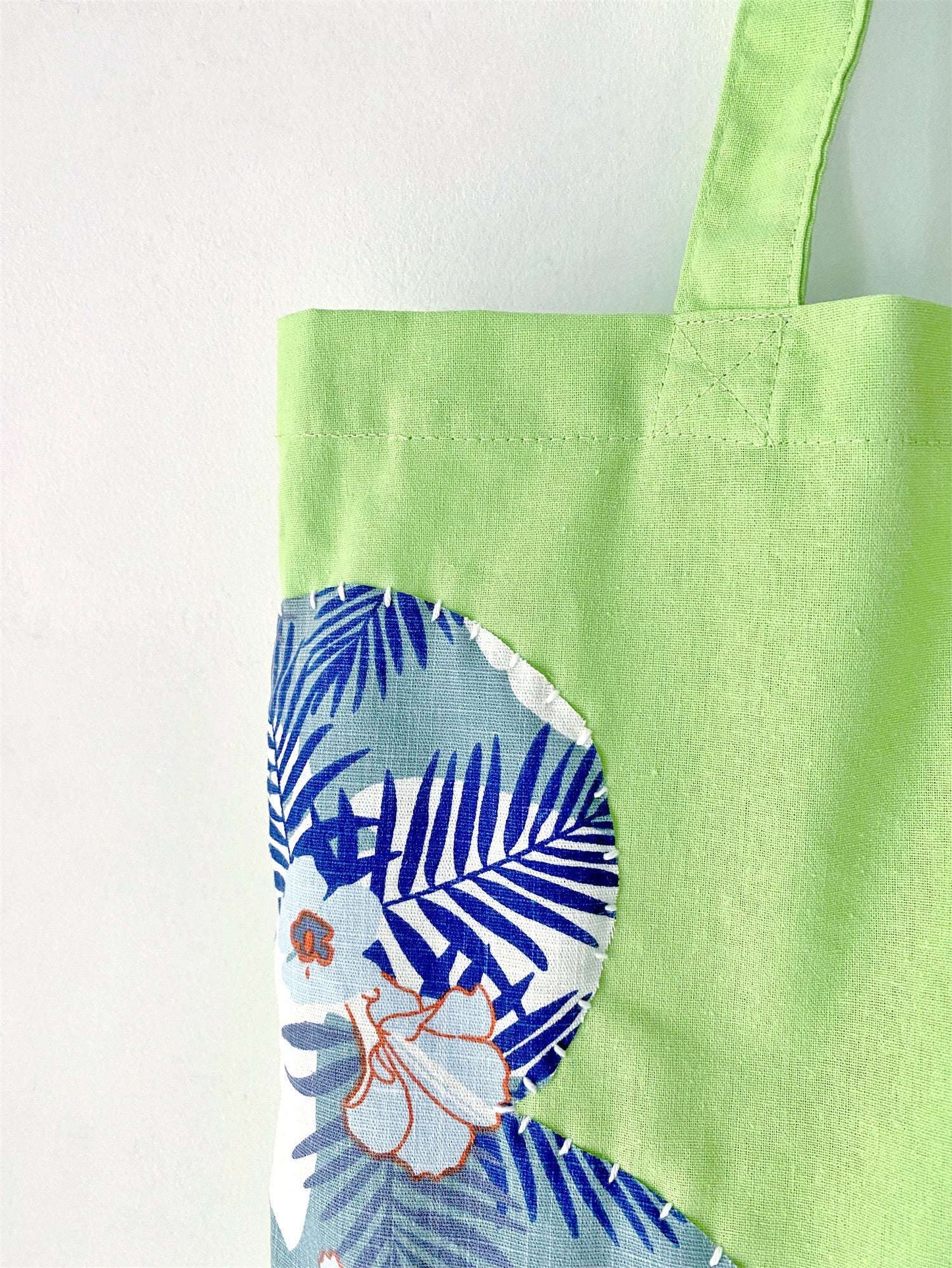 A spacious, lightweight tote with eco-friendly cotton and a hand-stitched patchwork design—perfect for gifting or adding an artisanal touch to your everyday style.