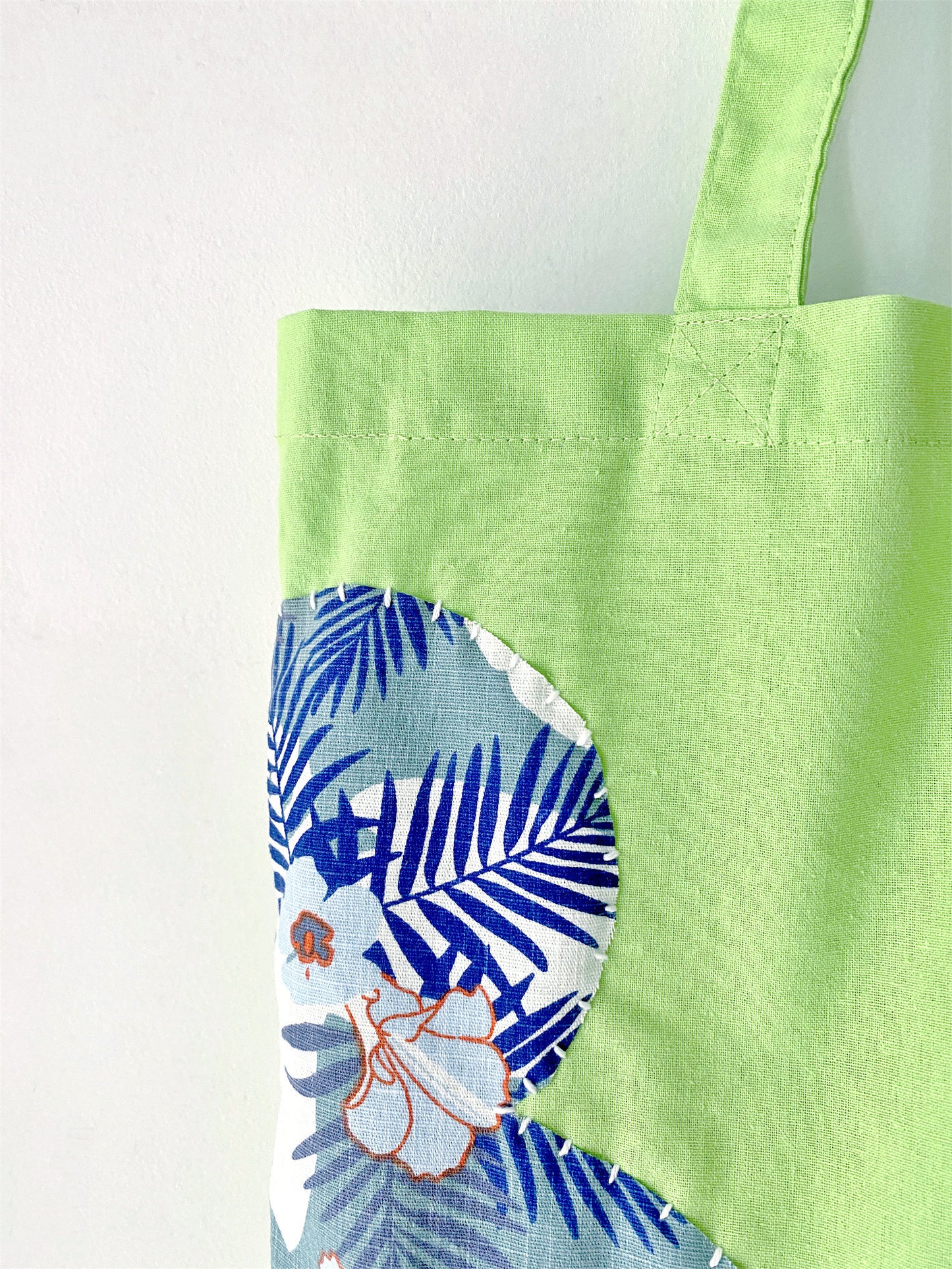 A spacious, lightweight tote with eco-friendly cotton and a hand-stitched patchwork design—perfect for gifting or adding an artisanal touch to your everyday style.