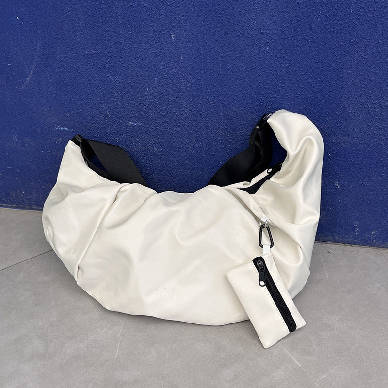 Soft curved crossbody bag for daily activities