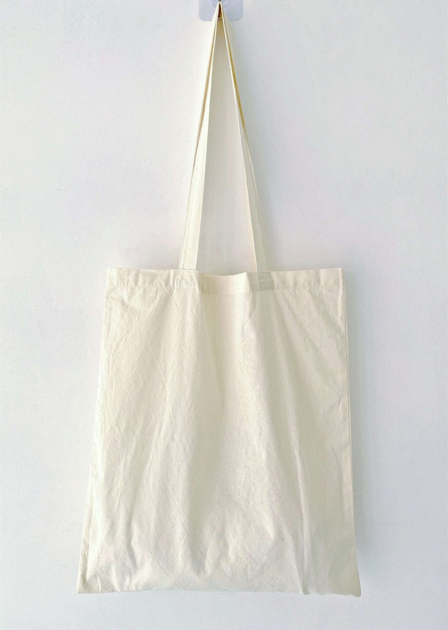 People who dislike overdesigned accessories tend to choose this cotton tote for its natural feel and subtle stitched details