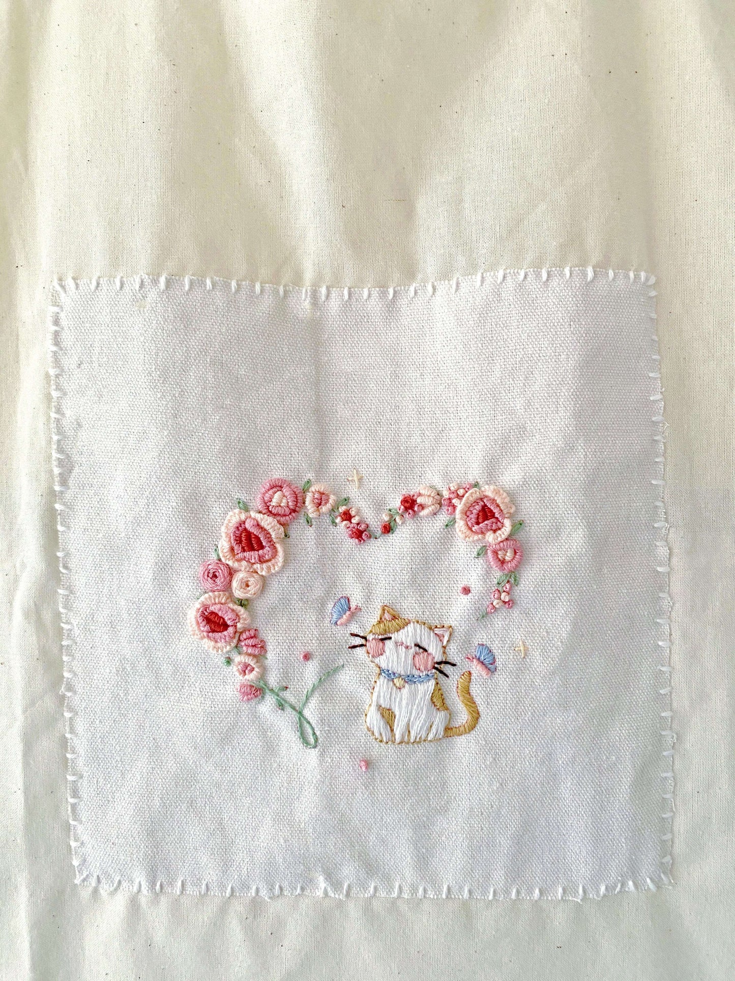 Lightweight hand-embroidered tote, the perfect mail-friendly gift to send love across long distances.