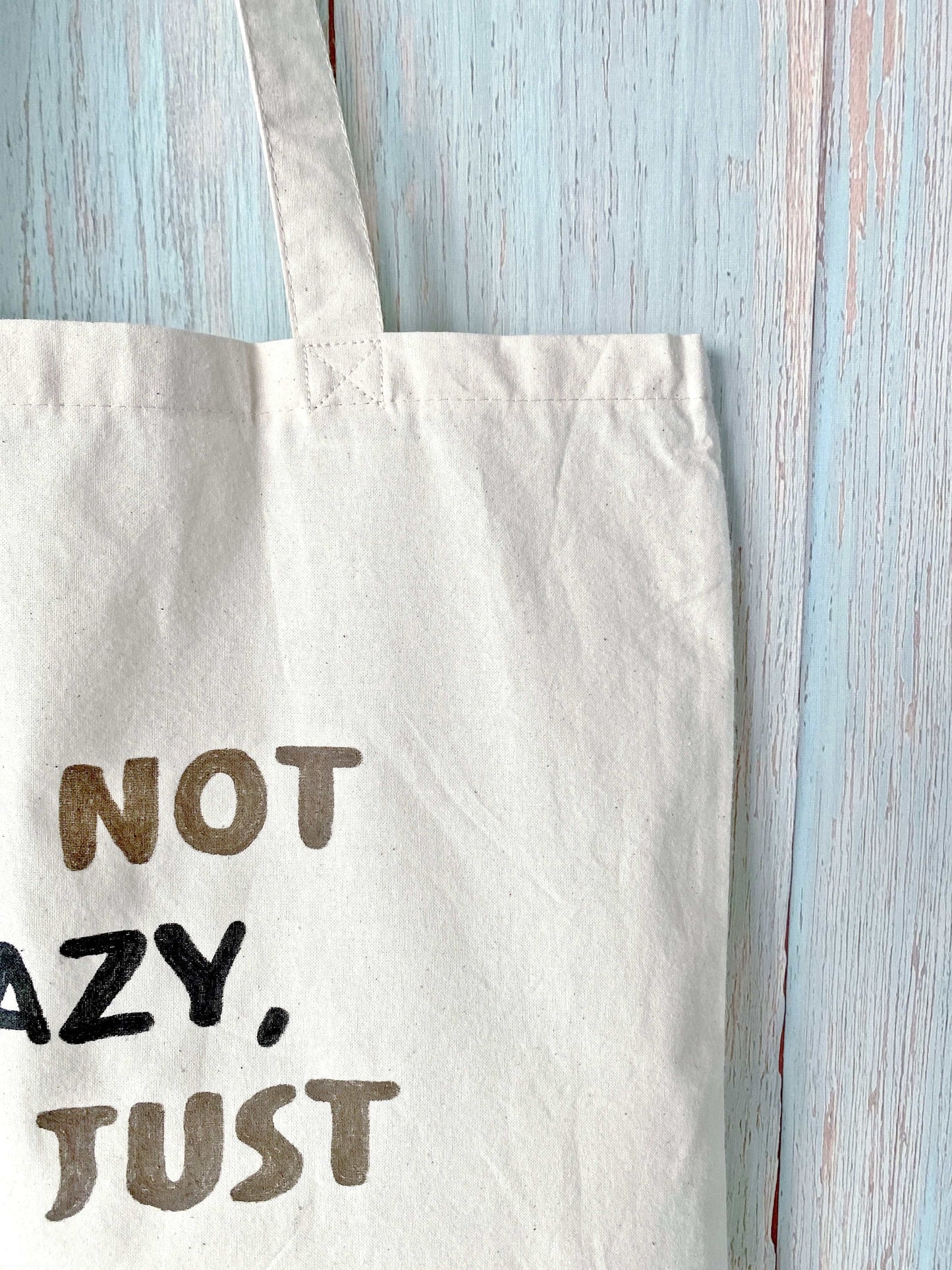 Durable cloth carryall holding heavy laptops and journals for a quiet university study session.