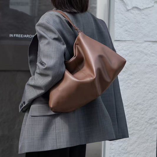 Black leather handbag with adjustable strap