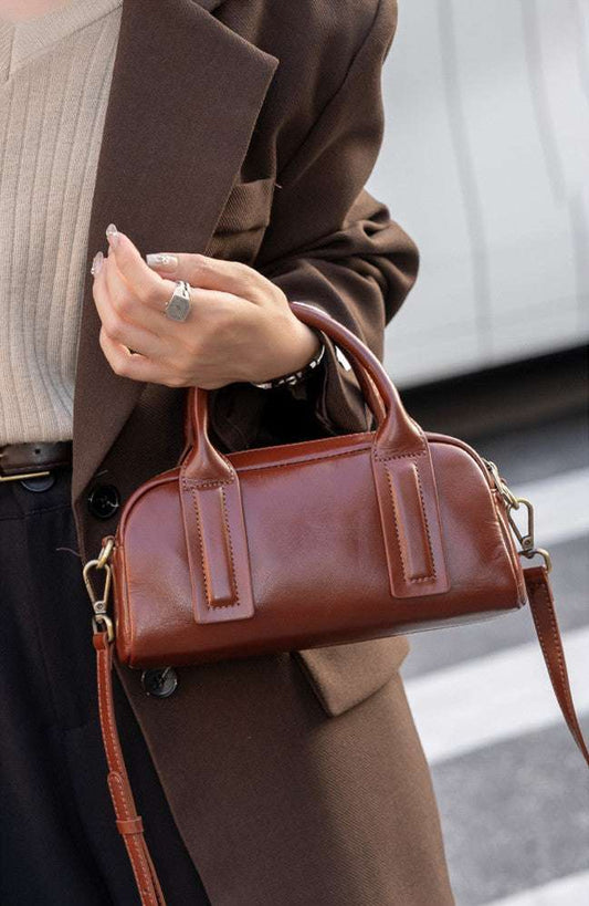 compact shoulder bag with gold hardware