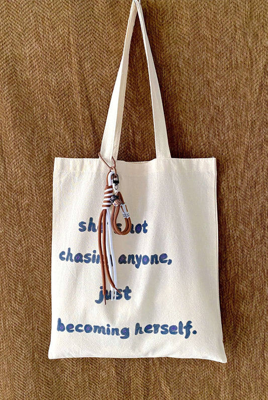Natural fiber tote bag with unique variations in hand-lettered typography