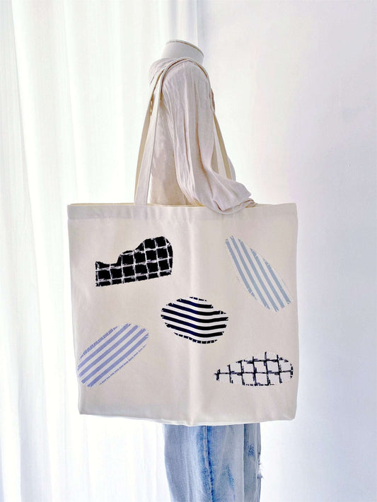 Whether it's a weekend getaway or a daily outing, this tote made from sustainable canvas with hand-stitched patchwork is the perfect companion for your eco-conscious adventures.