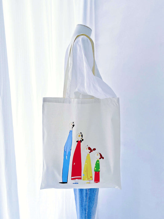 Large capacity, soft cotton tote with a unique hand-printed family motif—an accessory that adds a personal touch to everyday style.