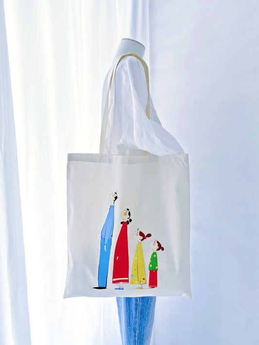 Large capacity, soft cotton tote with a unique hand-printed family motif—an accessory that adds a personal touch to everyday style.