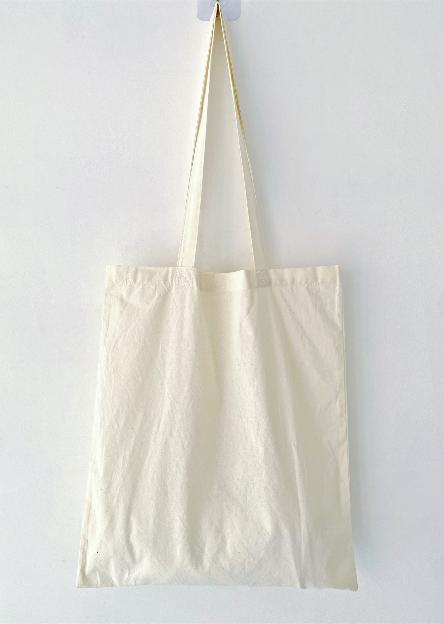 Stylish, sustainable, and roomy, this cotton tote with hand-embroidered flowers is a must-have accessory for any eco-conscious individual.