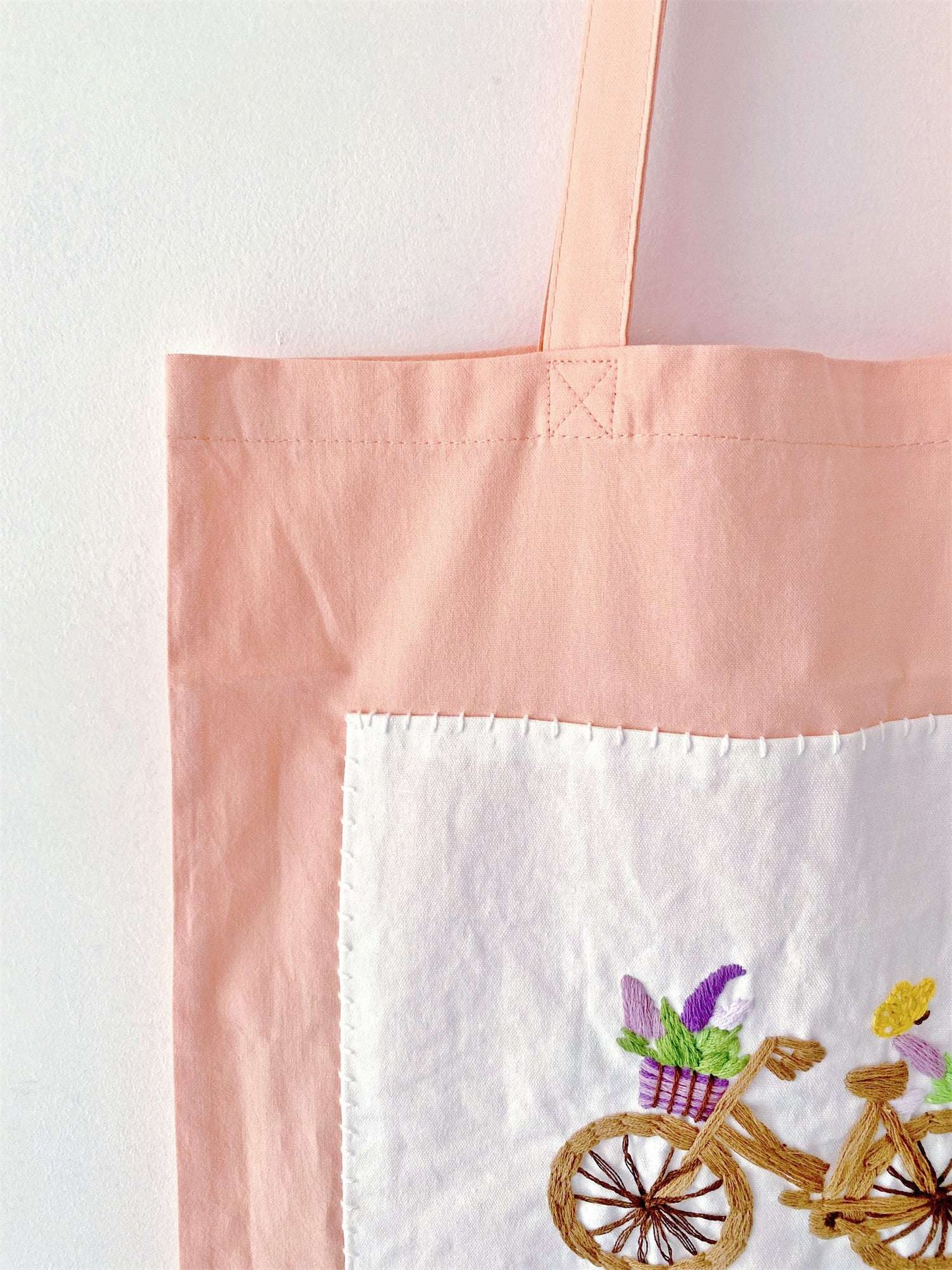 A touching thank you gift for a teacher who carries the weight of the world, this light cotton bag with hand stitched art offers a gentle, practical way to transport daily papers without adding bulk.