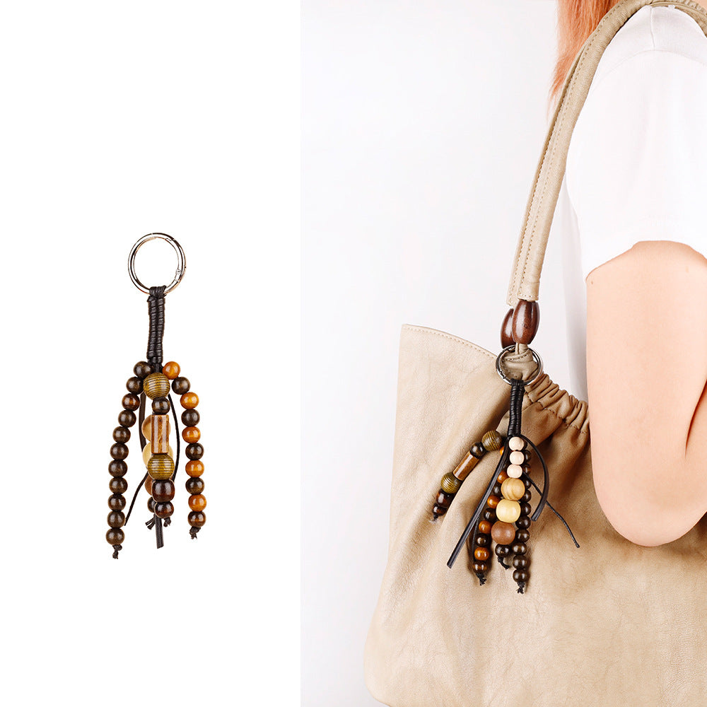 Natural wood bead ornament for a handbag handle