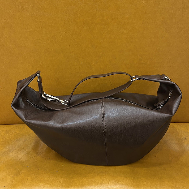 Crescent shoulder handbag for carrying personal items