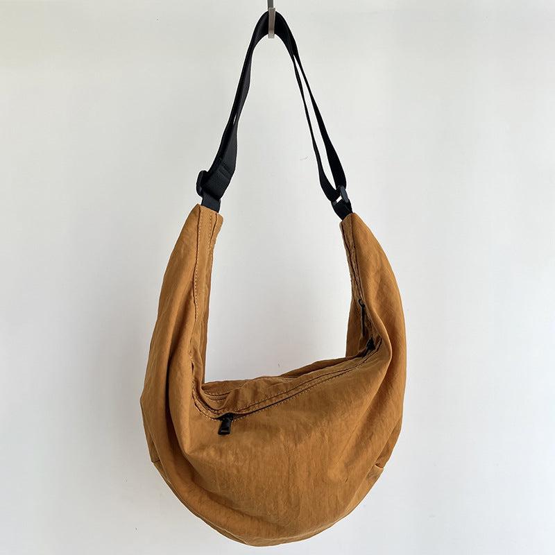 Minimalist plain fabric sling bag for everyday urban use