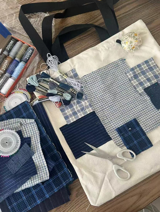 Close-up of the intricate hand-sewn edge binding on a finished bag, highlighting the durable stitching that prevents fraying in handmade accessories.