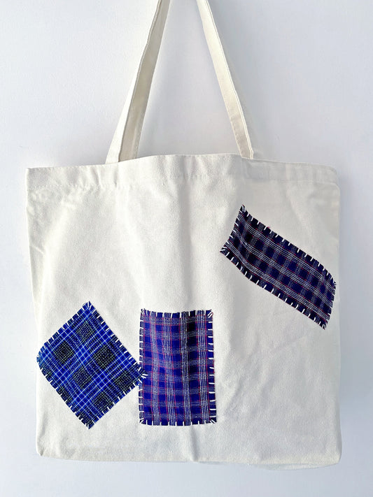 close-up of a limited edition tote bag showcasing intricate embroidery details