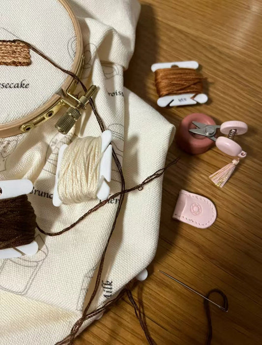 Finished DIY embroidered bag made from sustainable materials sitting on a wooden table.