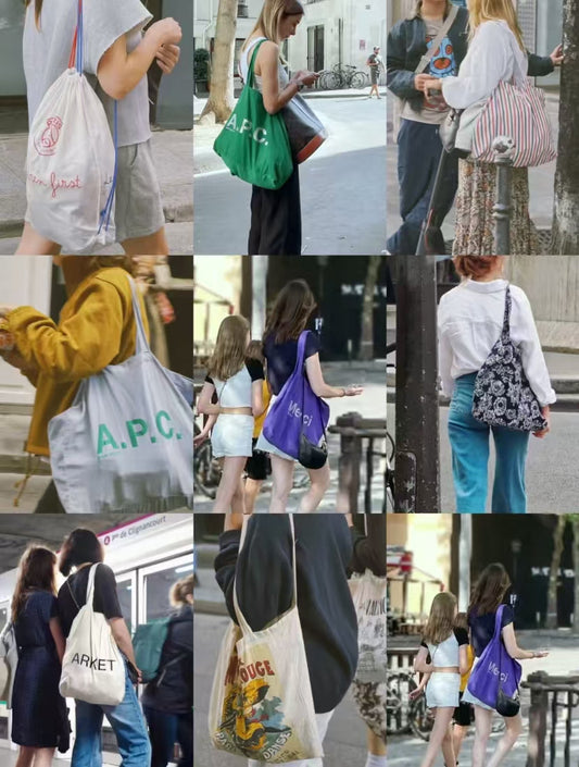 Detailed shot of reinforced cross-stitching and heavy-duty handles on a sustainable canvas bag.