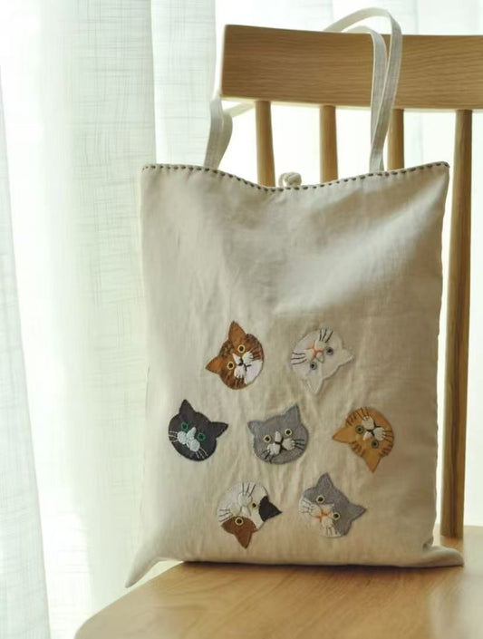 Detailed texture of sustainable patchwork fabrics used in high-quality artisan tote bags.