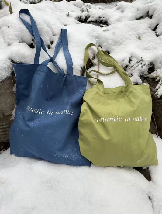 Tall and petite women comparing canvas bag sizes and styles