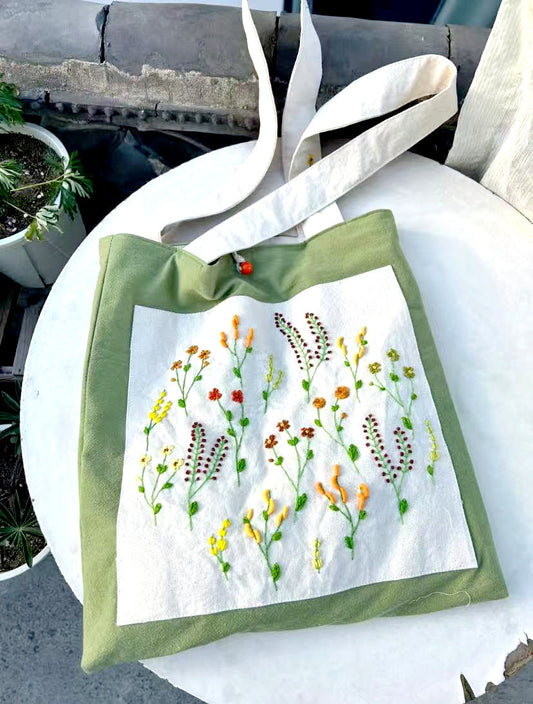 Personalized handmade jewelry—mismatched earrings with embroidered button and pearl