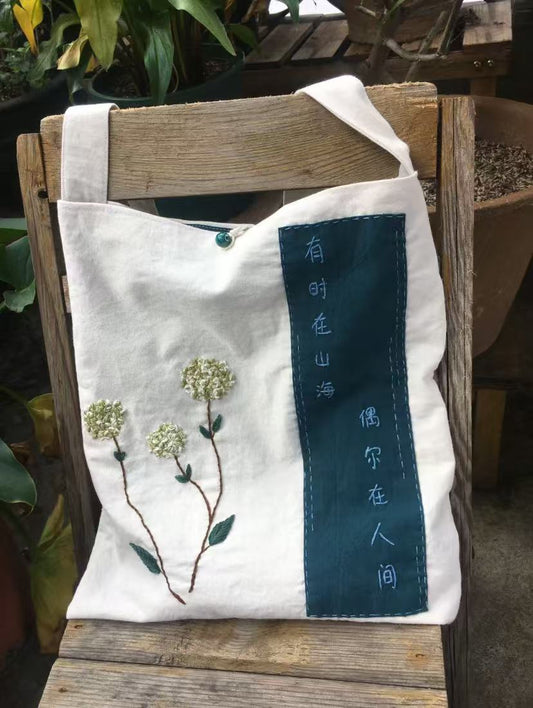 Small hand-embroidered floral hoop, showcasing the imperfections of handmade craft