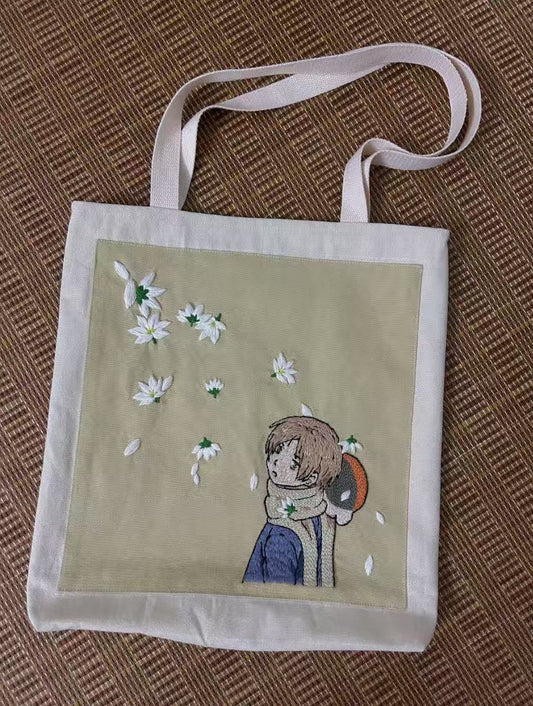 Someone carrying a stylish handmade canvas bag filled with fresh groceries and a laptop.