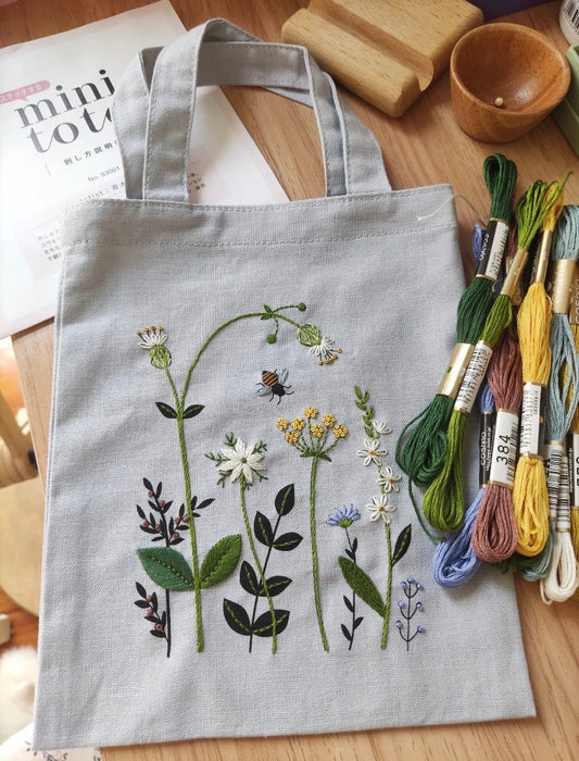 Handmade patchwork tote bag showing frayed edges and unique design.
