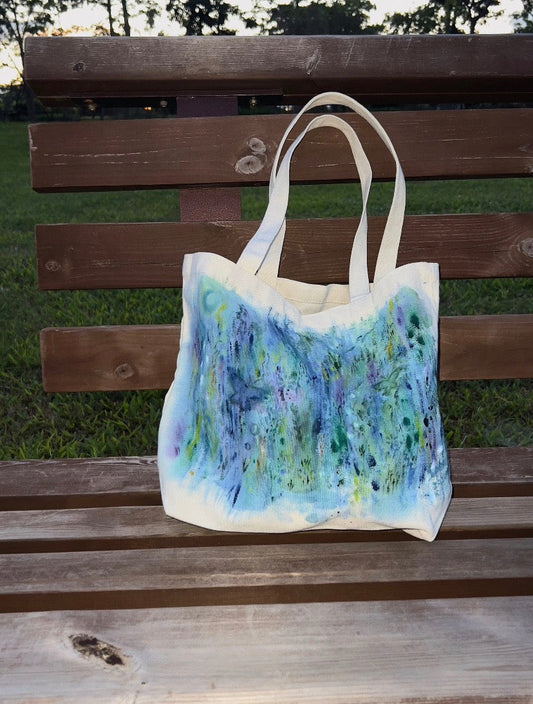 close-up of eco-friendly cotton tote bag showing imperfect hand-lettered design texture