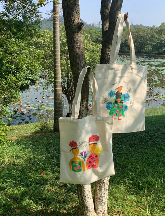 Soft cotton canvas tote bag with hand-printed and embroidered details for city commuting and travel