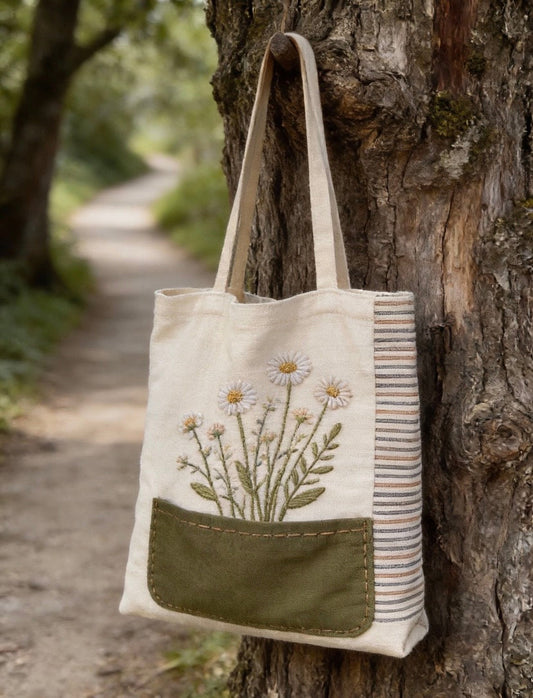 Eco-friendly fabric tote bag featuring patchwork and embroidery details