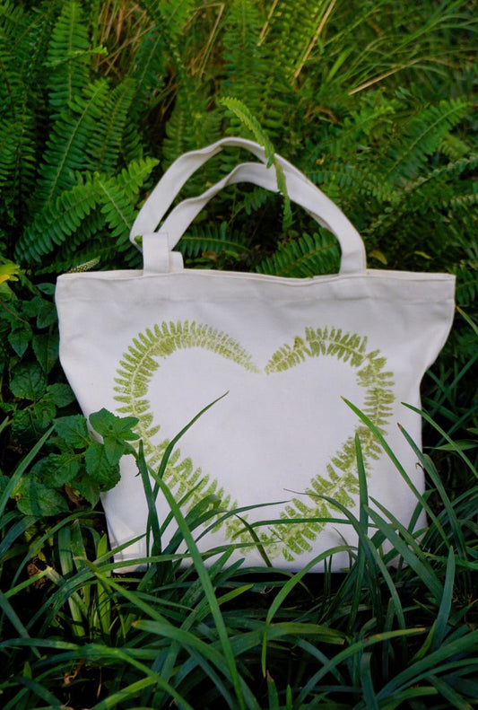 eco friendly reusable fabric bag with hand lettered design made from natural cotton