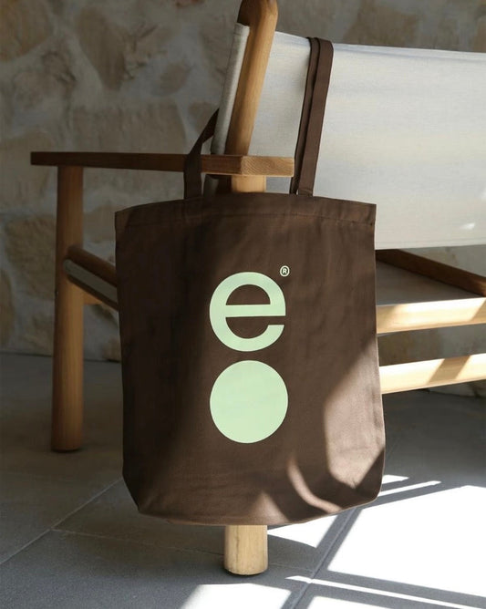 Durable patchwork tote bag for everyday use, holding groceries and books