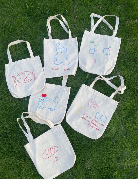 Hand-embroidered cotton tote bag for bridesmaids on a wedding day