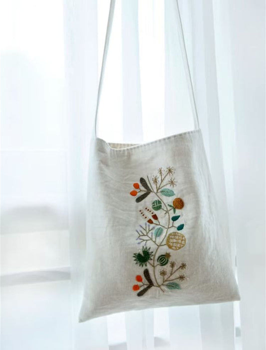 A curated collection of eco-friendly birthday gifts including natural skincare and artisan jewelry on a wooden table.